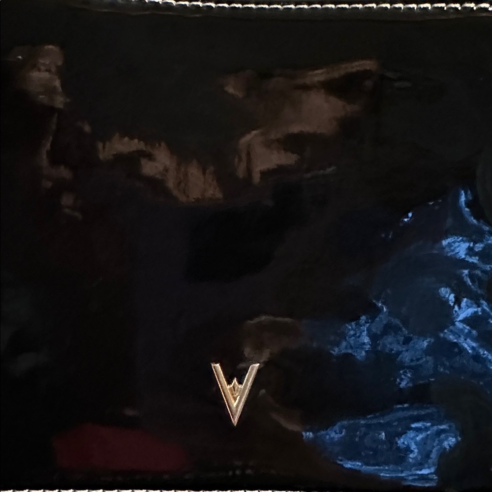 Vanessa Williams Black
Patent Leather Square Box
Camera Crossbody Bag - Picture 2 of 6